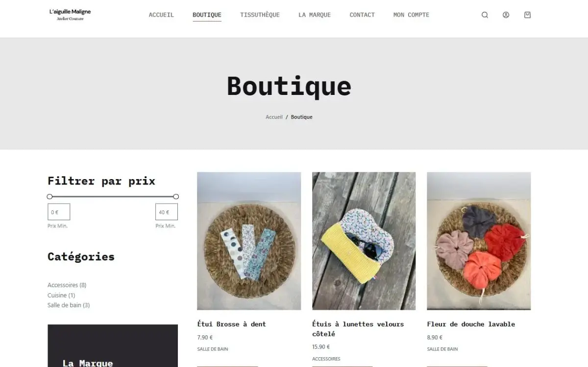 Page boutique en ligne du site de L'Aiguille Maligne avec ses créations couture